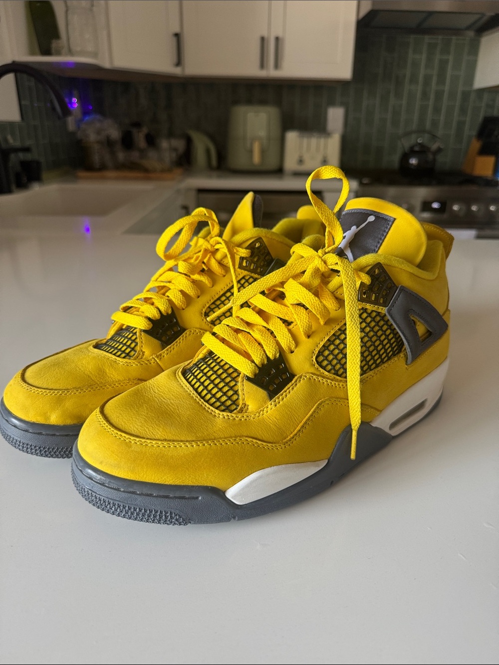 Air Jordan Retro 4 Lightning Suede Sneakers